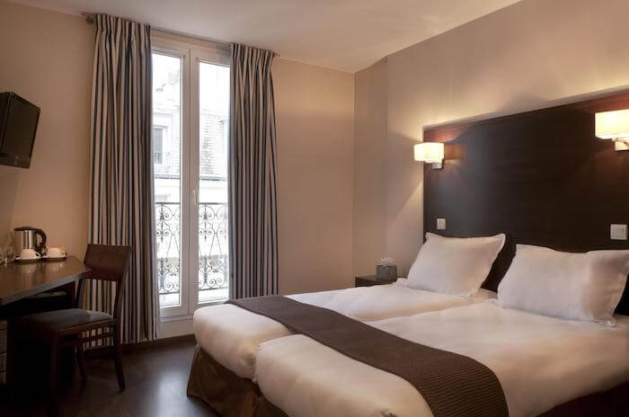 Quarto do Hotel Verlaine em Paris